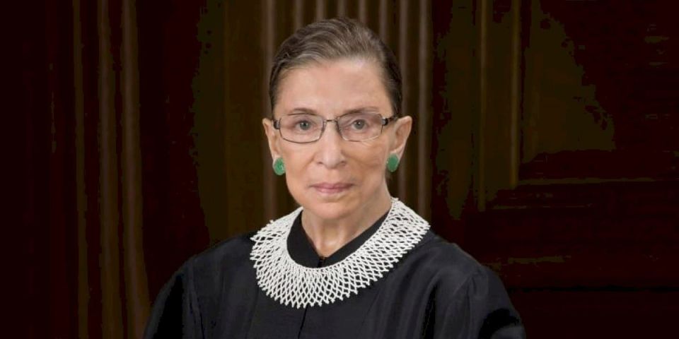 <a-href="https://tuairisc.ie"-class="credit-tuairisc"-target="-blank"-rel="noopener-noreferrer"></a>-bhi-leargas-ar-leith-ag-ruth-bader-ginsburg-ar-chas-na-mban